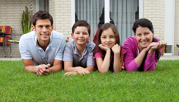 Happy family on their lawn